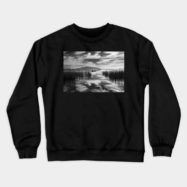 Fisherman between two skies Crewneck Sweatshirt by Cretense72